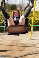 Playing on swing legs raised