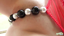 Beads covering her pussy lips