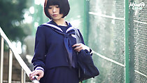 Short haired Minori pausing wearing kogal uniform hand resting on railing