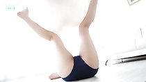 Lying on her back ball held between her legs dark blue shorts