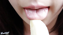 Tongue extended to tip of banana