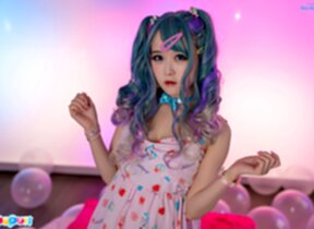 Ria Kurumi sucks lollipop while stripping dress and showing her shaved pussy