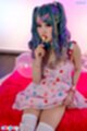Seated raising dress sucking lollipop