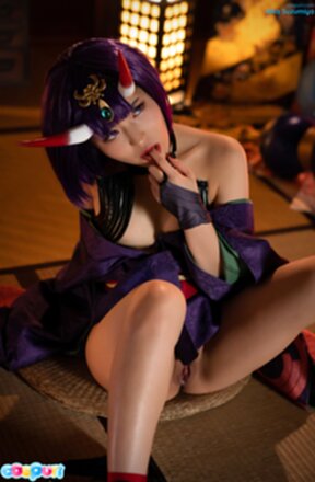 Aika Suzumiya seated with legs spread masturbating