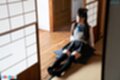 Sitting in doorway legs stretched out