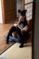 Ria kurumi seated knees drawn up