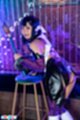 Mayu sakurai leaning against stool