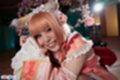 Misa seated beaming smile