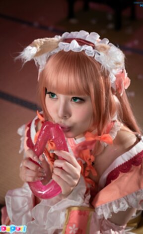 Misa on her knees licking and sucking dildo