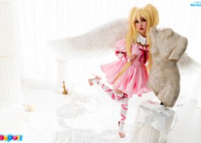 Ria Kurumi raising pink dress to show her shaved pussy and pert ass