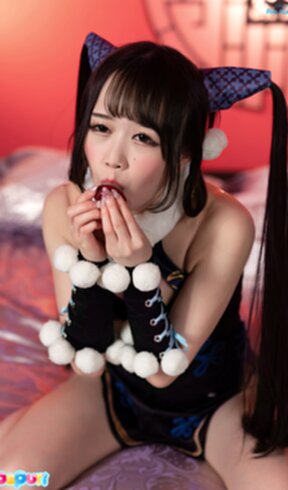 Ria Kurumi in cheongsam kneeling on bed