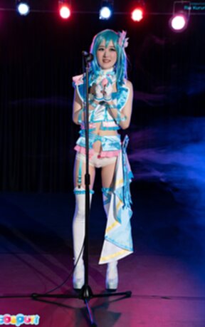 Ria Kurumi singing at microphone lowering panties