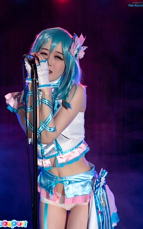 Ria Kurumi singing at microphone lowering panties
