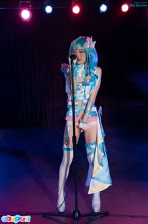 Ria Kurumi singing at microphone lowering panties