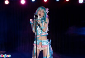 Ria Kurumi singing at microphone lowering panties