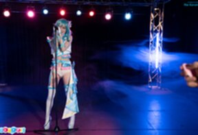 Ria Kurumi singing at microphone lowering panties