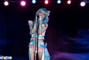 Ria Kurumi singing at microphone lowering panties