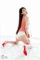 On her knees looking back long hair wearing panties high heels