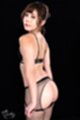 Lowering panties in fishnet stockings