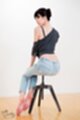 Anna matsuda seated in jeans bare feet