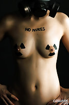 Topless with small breasts hands on hips