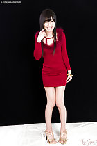 Kurihara Moeka in dress playing with her hair knees pressed together wearing high heels