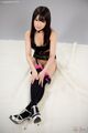 Shiina mizuho seated with hands on stockings ankles crossed high heels