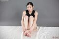 Enami ryu seated with knees drawn up bare feet