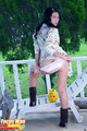 Standing in underwear wearing stockings in high heels