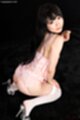 Kawagoe yui looking over her shoulder wearing white lingerie in high heels