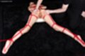 On her front tied up with rope pussy spread