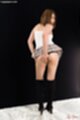 Leaning forward skirt raised over her panties