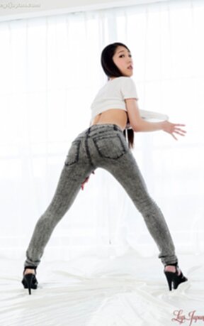 Kamimoto Rio raises top exposing small breasts and lowers jeans and panties