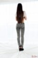 Long hair down her back ass in jeans high heels