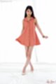 Wearing dress legs crossed high heels