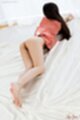 Lying on her front long hair ass raised bare feet