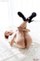 On her back legs raised high heels