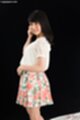 Looking back wearing floral skirt
