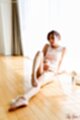 Sitting on floor legs stretched out bare feet