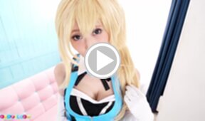 Mizuki bends over pink couch and lowers her panties and spreads pussy