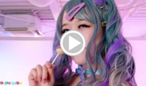 Ria Kurumi strips bra and panties and masturbates shaved pussy with lollipop